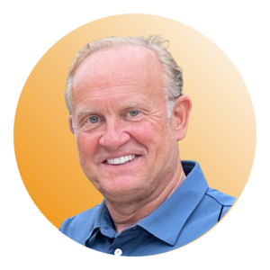 Greg Schall, Executive Vice President and Head of Hospitality Growth Strategy at SOLID Surface Care, smiling in front of an orange background
